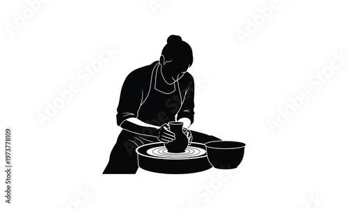 A potter shaping a clay vessel on a traditional wheel