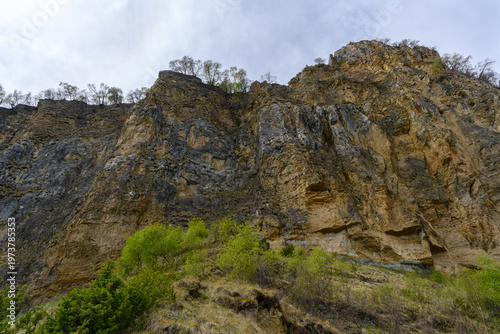 Rocky Cliff Face Under Cloudy Sky. Dagestan Russia.