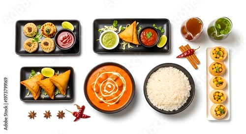 Assorted indian cuisine dishes with rice sauces and spices on black plates and bowls on white background