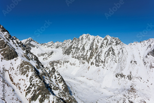 Mlynicka dolina, High Tatras, Vysoke Tatry, Slovakia. View from Predne Soliskslo. Beautiful winter mountain landscape is covered by snow in winter and wintertime. Sunny weather with clear blue sky.