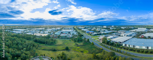 Drone aerial photograph of industrial buildings surrounded by lush greenery in the greater western Sydney suburb of Eastern Creek, New South Wales, Australia