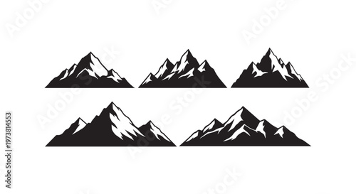 Sharp mountain peaks silhouetted against a clear sky in striking black and white artistry