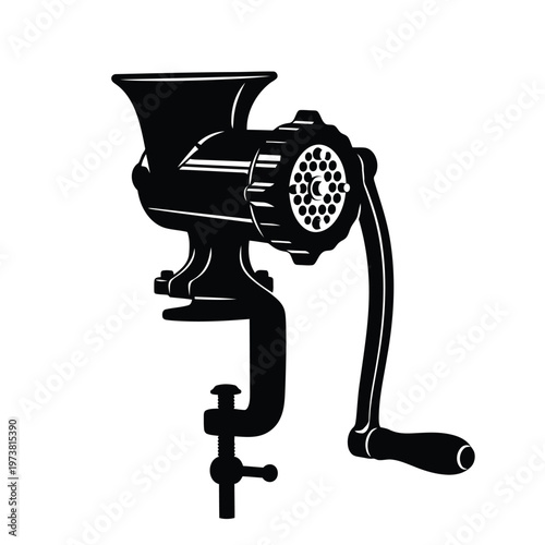 A vintage manual meat grinder sits on a kitchen countertop with a handle and crank.