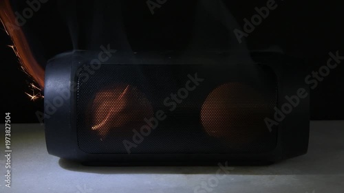 Portable speaker ignites and smokes due to malfunction creating fire hazard