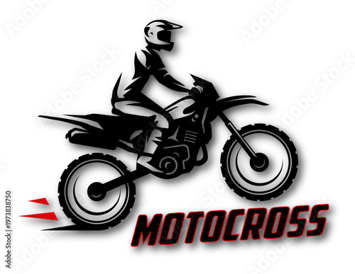 A dirt bike rider jumps into the air while racing on a dirt track. The rider wears a helmet and protective gear. Dust rises from the ground during the race.