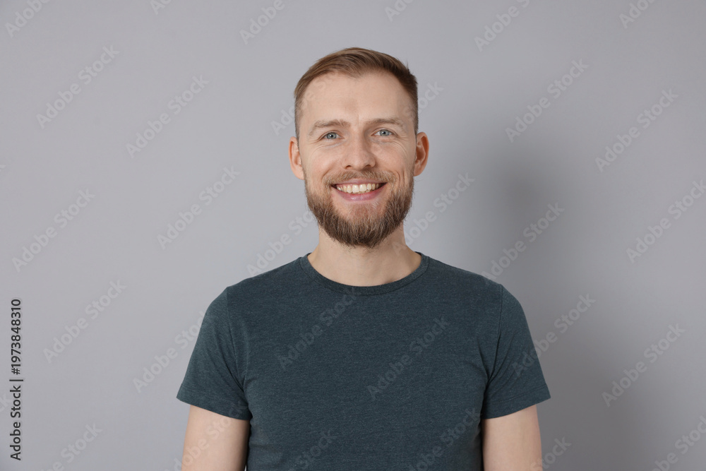 Obraz premium Portrait of handsome man on light grey background