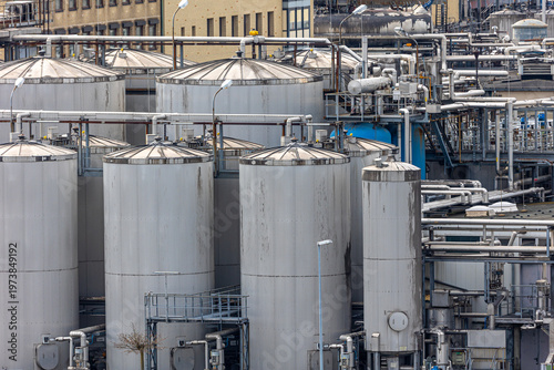 Large storage tanks at industrial chemical plant facility