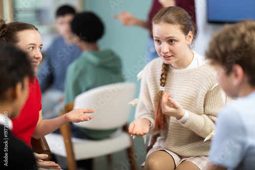 Two teams of teens, participants are negotiating, consulting, rehearsing performance. Acting masters courses, stage speech courses, public speaking courses, group practice of public speaking