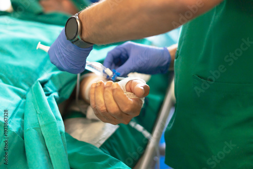 Medical professional giving intravenous fluid to patient