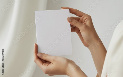 A woman hands holding an empty blank card with copy space for an advertisement message