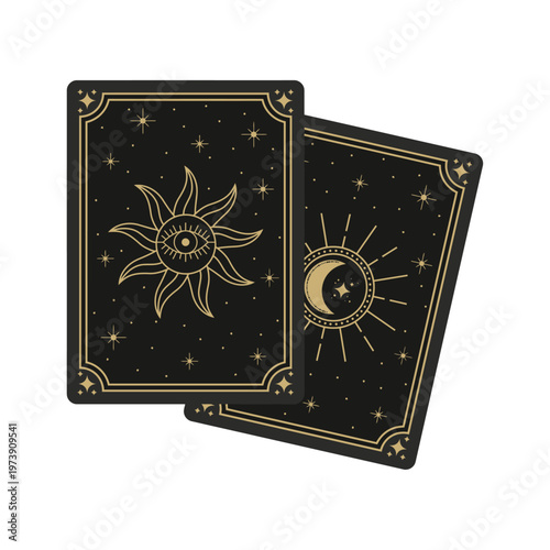 Two black tarot cards with gold designs of a sun and moon on a white background in a close-up view.