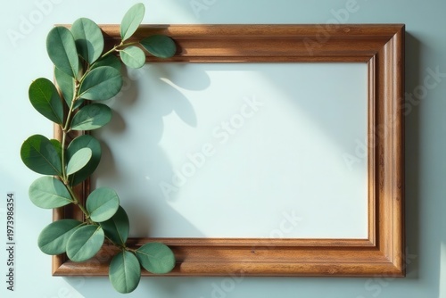 Elegant wood portrait frame, fresh eucalyptus leaves  ,  empty,  mockup,  minimal