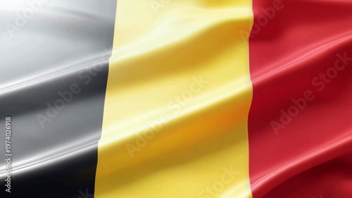A close-up view of the Belgian national flag, featuring its distinctive vertical black, yellow, and red stripes in a flowing, silky texture.
