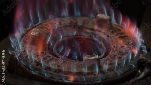4K Close-up of gas stove burner flame in kitchen showing blue fire energy for cooking Household kitchen, Concept ideal for cooking energy use and home lifestyle content.