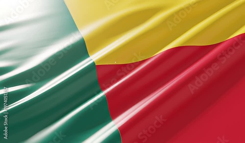 Close-up view of the national flag of Benin, featuring its vibrant green, yellow, and red colors waving gently.