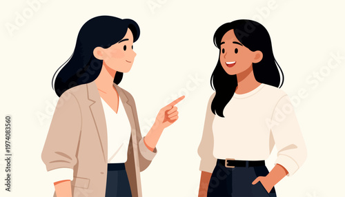 Two women chat warmly in a friendly conversation. One gestures while smiling, showing engagement and interest. The other listens attentively, her expression open and curious