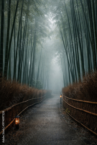 Misty bamboo forest pathway with glowing lanterns and wet stone walkway leading through towering green stalks in soft morning fog creating a serene travel landscape with moody atmospheric depth