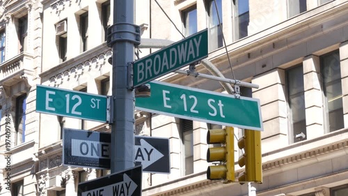 New York City Broadway street sign on Manhattan, United States. Urban road sign in american city. Traffic sign in Midtown of NYC, USA. Building architecture in residential district near Union Square.