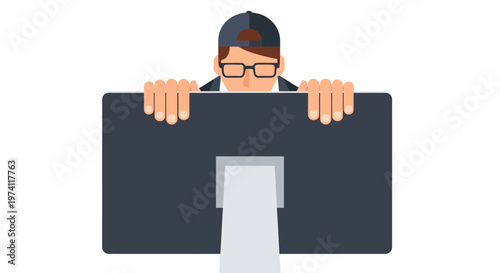 Man wearing cap and glasses peeking behind large computer monitor representing digital presence and tech curiosity