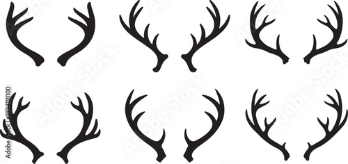 Set of black deer antler silhouettes on white background