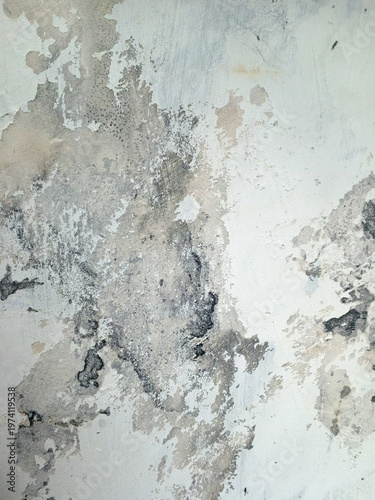 Abstract textured background resembling weathered concrete wall with peeling paint, stains, and gray beige watercolor like patches minimal neutral tones, distressed surface, vertical composition.