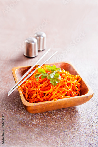 Carrot salad. French Grated Carrot Salad. Shredded carrot with garlic and black pepper