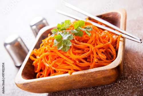 Carrot salad. French Grated Carrot Salad. Shredded carrot with garlic and black pepper