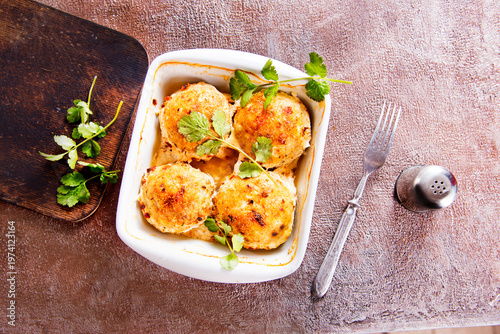 baked chicken cutlets in white bowl