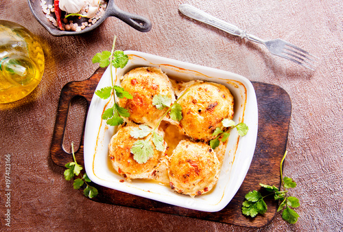baked chicken cutlets in white bowl