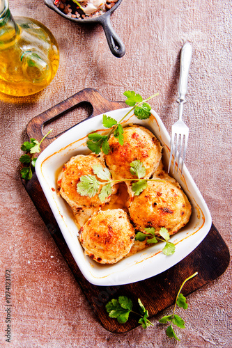 baked chicken cutlets in white bowl