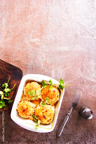 baked chicken cutlets in white bowl