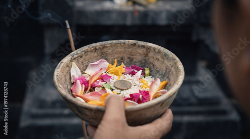 Balinese Hindu Offering Canang Sari with Flowers and Incense - Traditional Spiritual Ritual in Bali, Indonesia