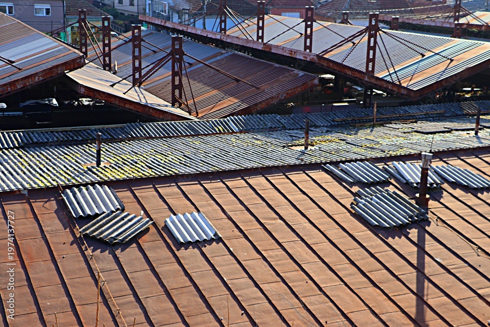Naklejka premium Top view of old rusty metal roofs