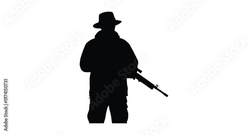 Armed figure with rifle stands in stark contrast a dramatic silhouette