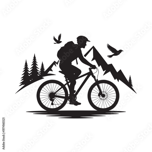Silhouette of a mountain biker riding through a scenic mountainous landscape