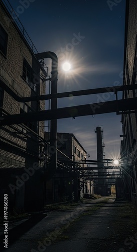 Industrial Nightscape - Pipes and Buildings Under Moonlight.