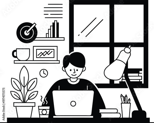 man working on laptop at desk with office supplies