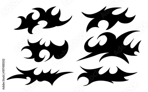 Set of black tribal flame designs and abstract decorative patterns on a white background, suitable for tattoos or graphic elements.