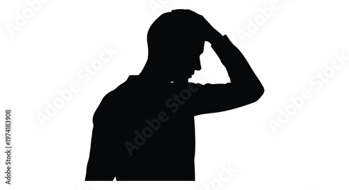 Man in suit with hand to head expressing frustration a dark silhouette