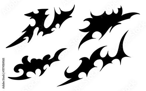 Four black tribal style abstract designs with sharp edges and curved patterns, suitable for tattoos or graphic elements.