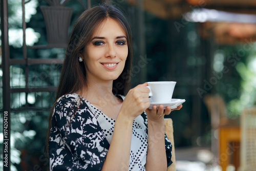 Принти на полотні Happy Woman Holding a Coffee Cup in a restaurant