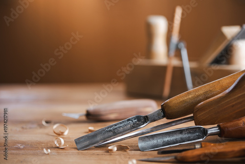 Woodworking tools on wooden workbench in carpentry workshop. Joinery and craft carving tools for wood processing.