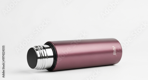 Elegant Rose Gold Stainless Steel Water Bottle on White Background.