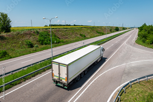 Trailer truck on highway on summer day
