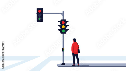 Responsible male pedestrian standing on sidewalk waiting for traffic lights to change to green before crossing city street.