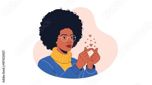 Happy young woman with an afro hairstyle wearing glasses and making a finger heart gesture surrounded by small floating hearts.