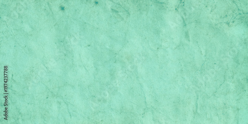 Mint green textured background with subtle wrinkles and imperfections for design and decoration