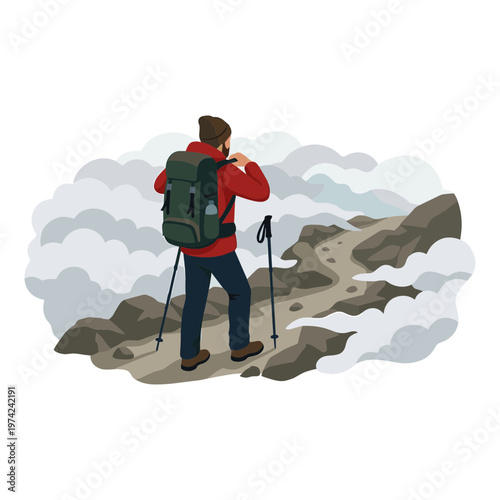 Man hiking on mountain peak with backpack and trekking poles in foggy weather