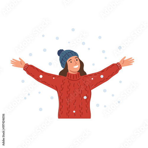 Woman wearing red sweater and blue hat enjoys snowfall with outstretched arms in winter.