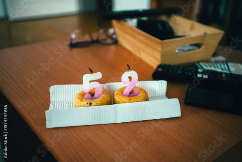 Extinguished birthday candles in the shape of the number 52